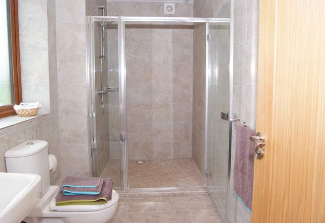 The main bedroom has a really large walk-in shower in its en suite shower-room.