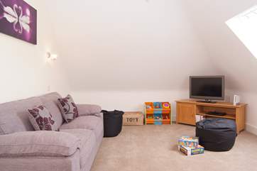 Last but not least - on the second floor - there is even this wonderful play-room equipped with TV, games and toys for children.