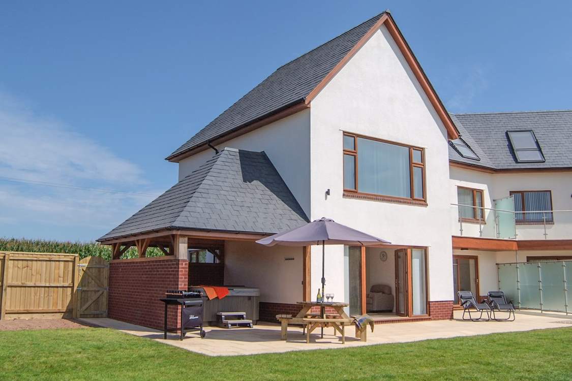 Lakeview House and Lakeside House are semi-detached. There are privacy glass panels close to the house and then fencing between the two gardens.