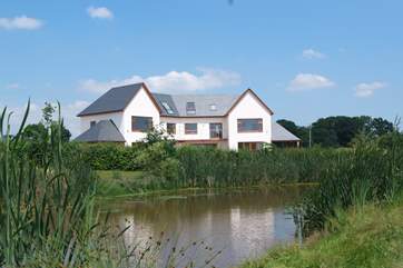 Lakeside House is to the right of these stunning holiday properties. Each has its own fully enclosed garden, privacy glass for the patios and fencing.