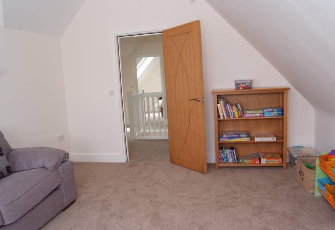 The play-room is on the second floor. There is a large TV, DVD player, all number of games and toys.