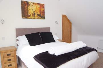 This double bedrom is on the second floor. It has a wonderful retractable balcony with amazing views.