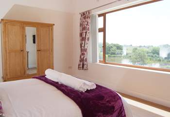 The master bedroom has a stunning panoramic view over the lakes and the countryside beyond.