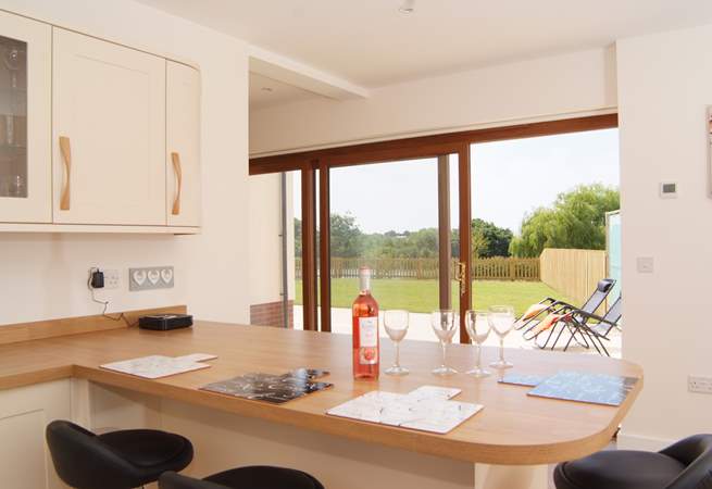 The lovely bright kitchen has a sliding door to the patio.