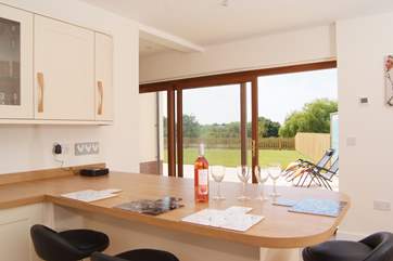 The lovely bright kitchen has a sliding door to the patio.