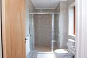 The walk in  shower is supersize with a drench shower head. What a treat.