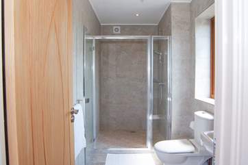 The walk in shower is supersize with a drench shower head. What a treat.