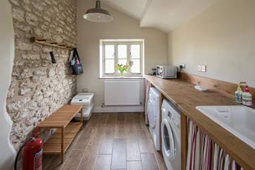 So much space for storage in the utility/boot-room, which also houses the laundry facilities, microwave and freezer.