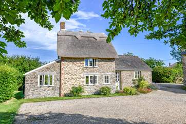 This gorgeous cottage has recently been re-thatched. Spot the sweet pair of pheasants perched on the roof.