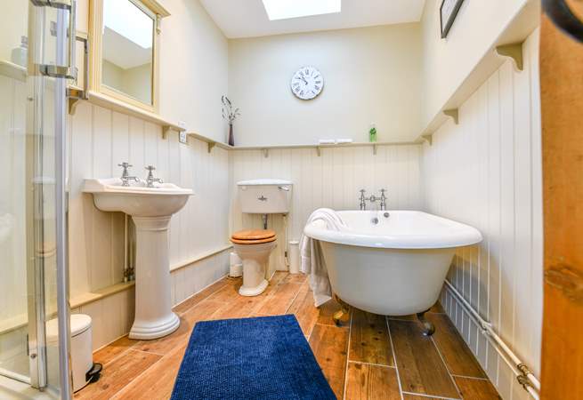 The luxurious bathroom is on the ground floor with roll-top bath and separate shower cubicle.