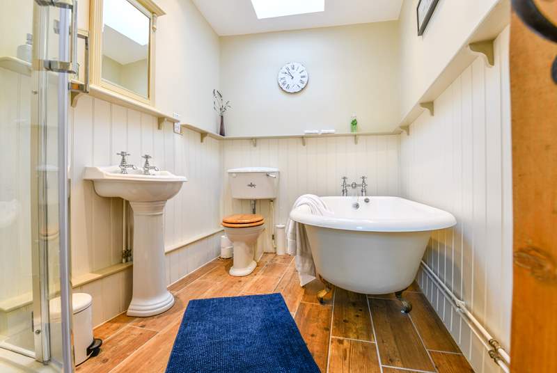 The luxurious bathroom is on the ground floor with roll-top bath and separate shower cubicle.