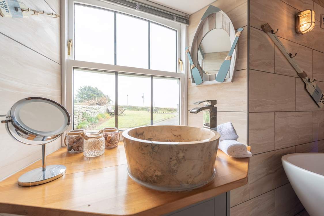 The bathroom has both modern and quirky fittings.