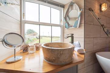 The bathroom has modern and quirky fittings.