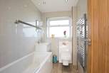 The family bathroom is located on the second floor. Get the hot water running, the bubbles poured and have a lovely bubble bath.