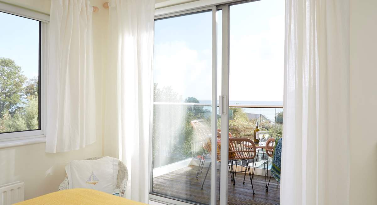 The balcony invites you to step outside and embrace the fresh sea air. 