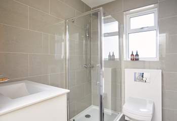 The principal bedroom has a modern en suite shower-room.