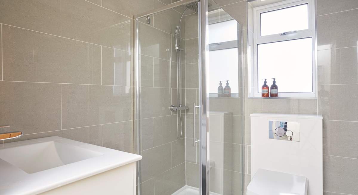 The principal bedroom has a modern en suite shower-room.