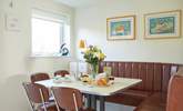 Plan your day ahead over a delicious breakfast in the dining area, designed with a retro feel and seating for eight. - Thumbnail Image