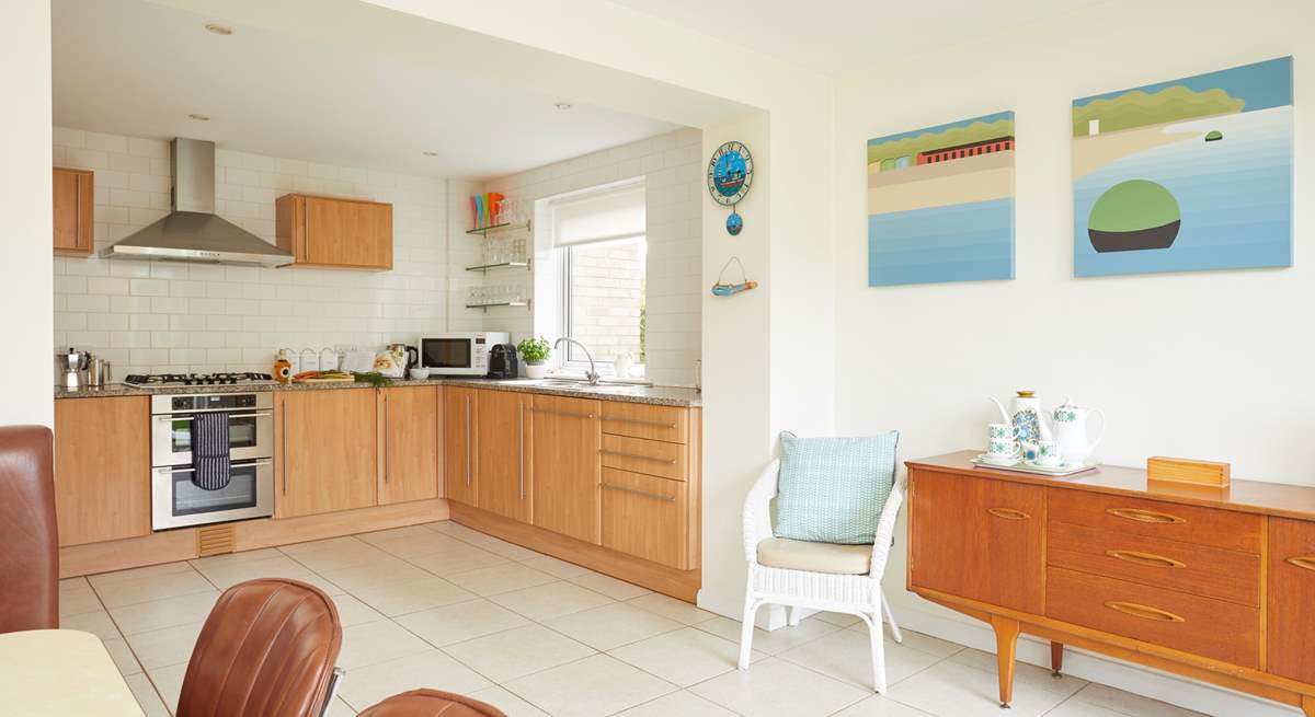 The open plan kitchen/dining-room is a fabulous, large, light space for entertaining while preparing meals.