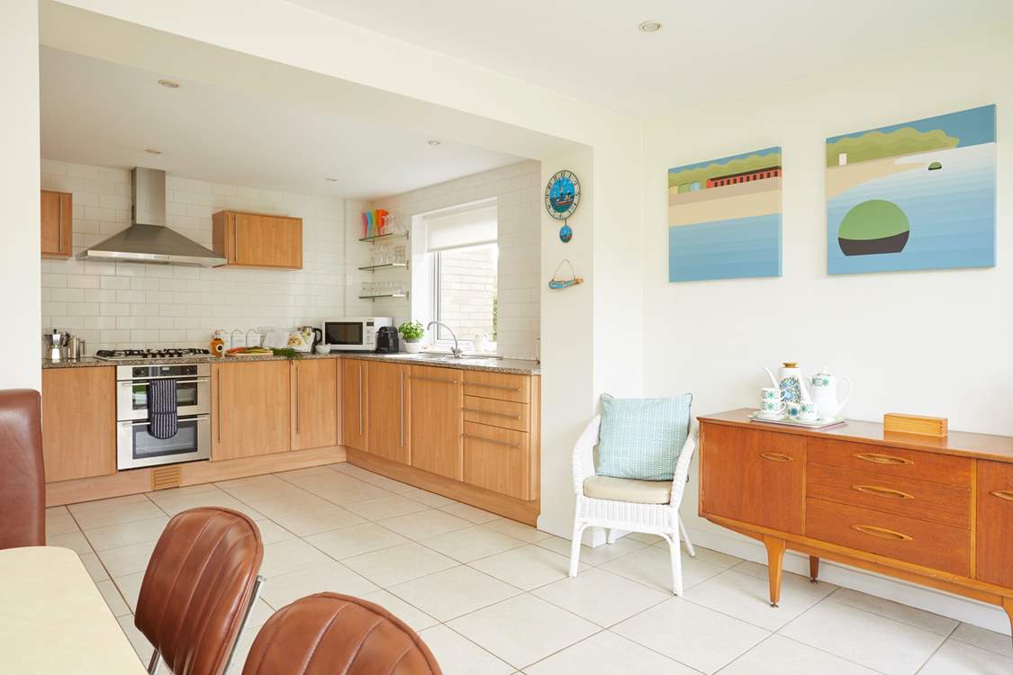 The open plan kitchen/dining-room is a fabulous, large, light space for entertaining while preparing meals.