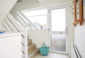 Step into the light and bright entrance hall with a set of steps that take you up to the first floor where you will find the beautiful sitting room.