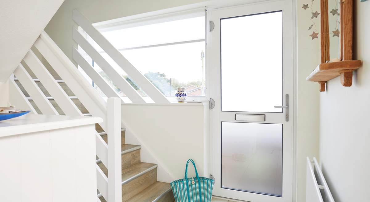 Step into the light and bright entrance hall with a set of steps that take you up to the first floor where you will find the beautiful sitting room.