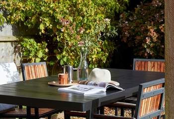 A perfect afternoon escape: coffee time with a good book, and warm sunshine make for happy memories. 