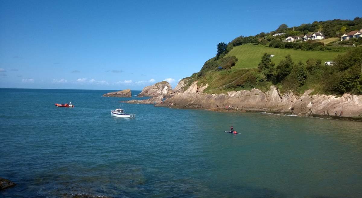 This is Combe Martin, with a lovely sandy bay - and in the distance the cliffs are where Exmoor meets the sea.