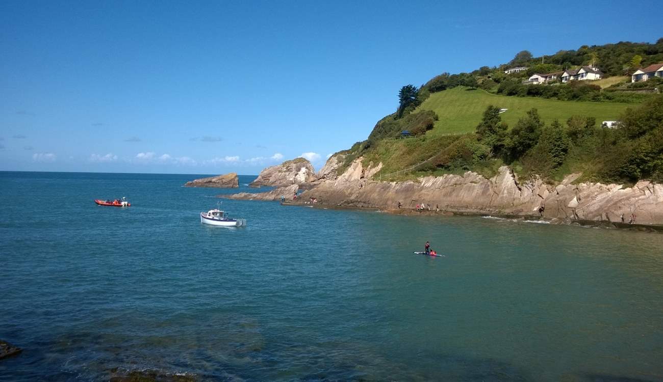 This is Combe Martin, with a lovely sandy bay - and in the distance the cliffs are where Exmoor meets the sea.