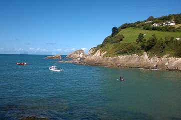 This is Combe Martin, with a lovely sandy bay - and in the distance the cliffs are where Exmoor meets the sea.