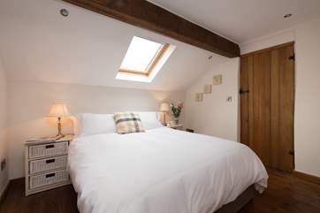 This is one of the two double bedrooms. This bedroom has an en suite WC and wash-basin.