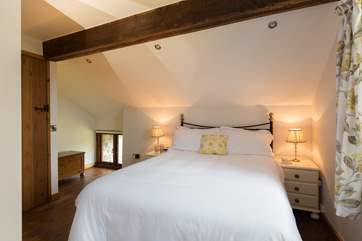 Another view of this bedroom. The little low window looks to the front of the barn.