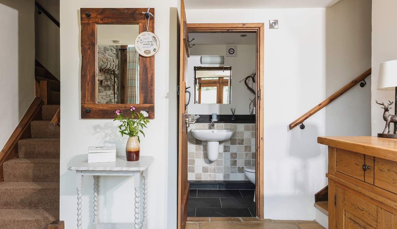 The downstairs WC is next to this step up into the kitchen/diner.