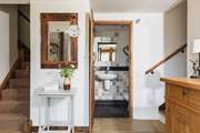 The downstairs WC is next to this step up into the kitchen/diner.
