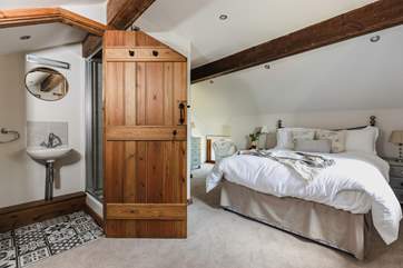 This is the second double bedroom. This bedroom has an en suite shower, WC and wash-basin.