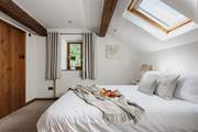 This is one of the two double bedrooms. This bedroom has an en suite WC and wash-basin.