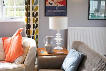 This property has been thoughtfully decorated and furnished with a warm retro feel.