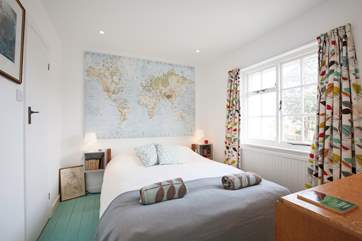 The ground floor double bedroom is full of light with a lovely feature wall.