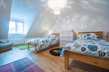 The twin room on the first floor, this room also has a play area and a TV.