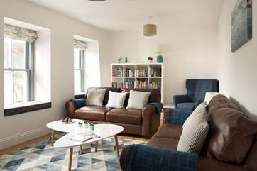 A light and comfy sitting-room to relax in.
