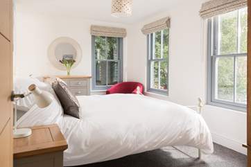 Bedroom 3 has a king-size bed and creek views.