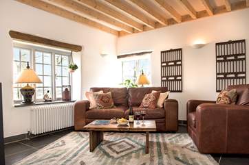 Oak lintels, slate floors and exposed beams enhance the overall character and charm.