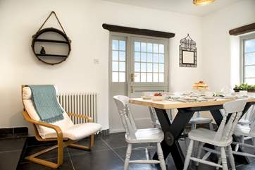 Enjoy leisurely meals at the dining-table or open up the stable-door to the garden.