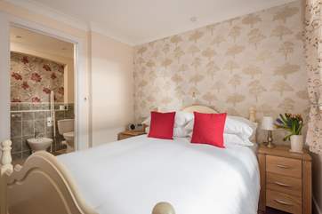 The en suite leads off from the bedroom.
