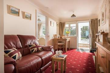 The sitting/dining-room is light, airy and very comfortable.