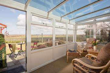 The conservatory takes full advantage of the rural views.