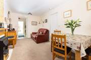 The sitting/dining-room is light, airy and very comfortable.
