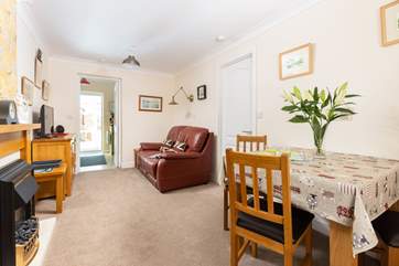 The sitting/dining-room is light, airy and very comfortable.