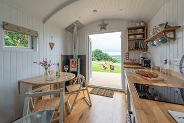 There is a pull out dining-table and chairs for four which packs away neatly when not required.