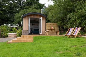 With a lovely decked patio and its very own hot tub too.